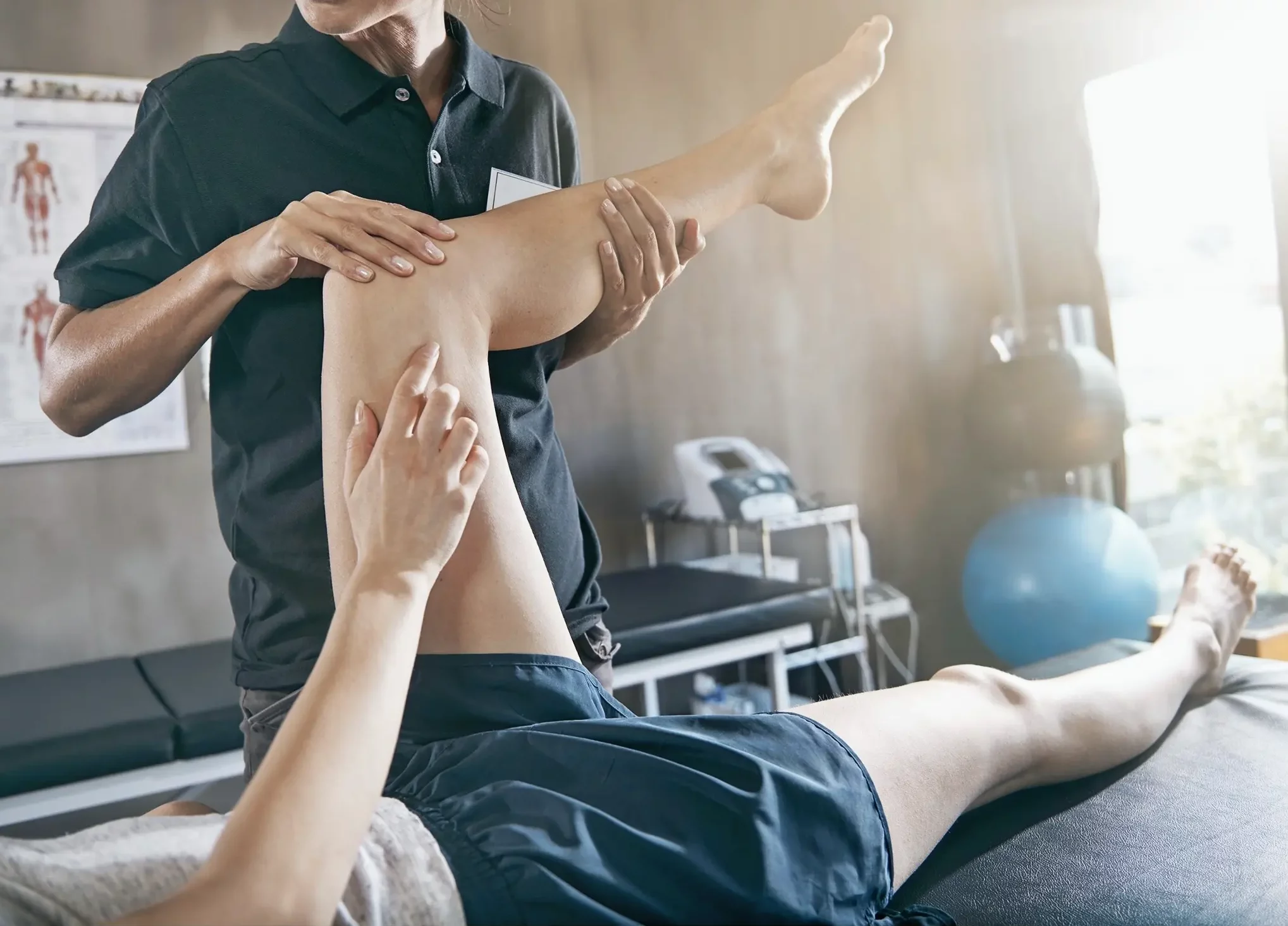 Hands-on assessment of hip and leg movement at The Sogunro Practice, London Colney, St Albans