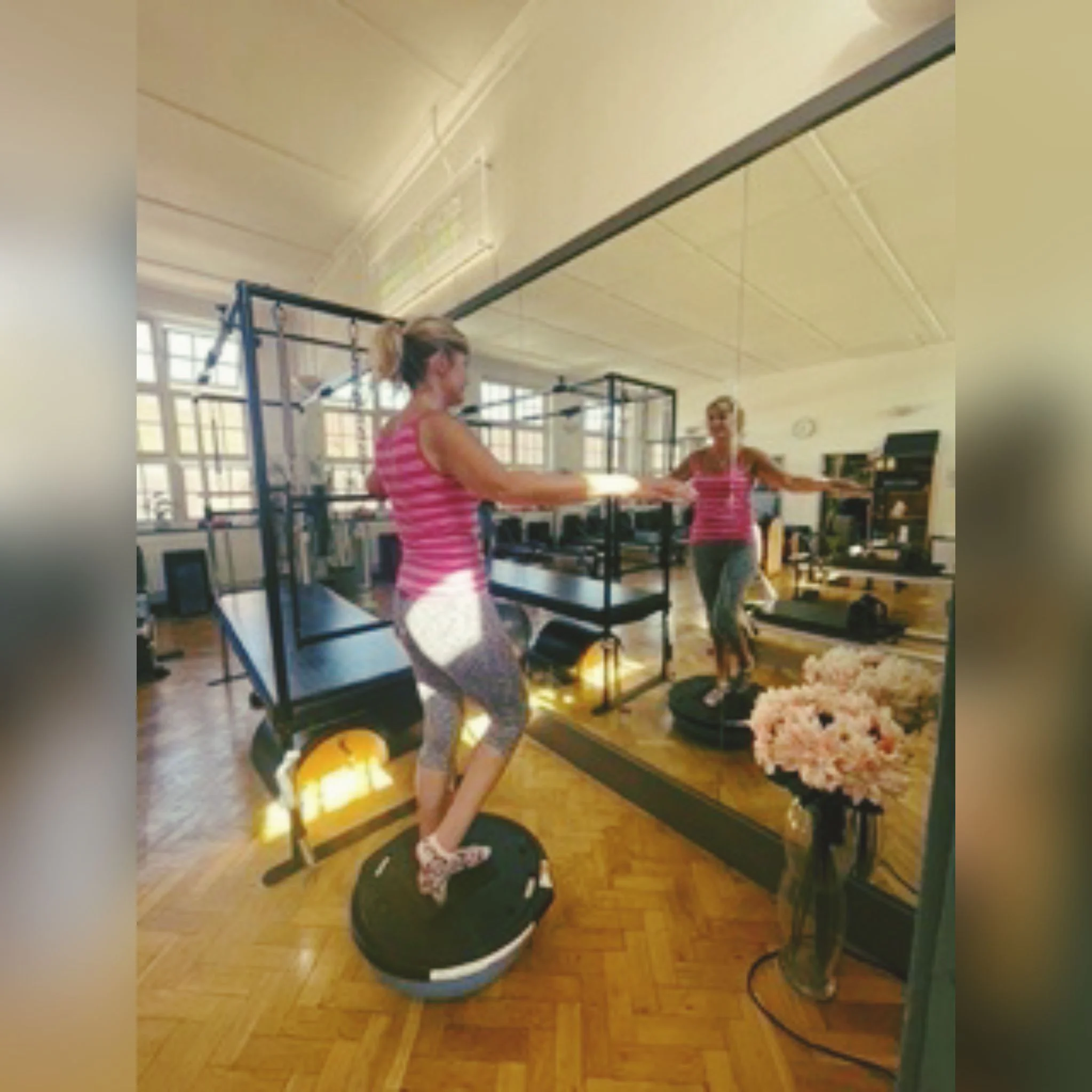 Client working on standing balance and joint control at Applied Pilates, London Colney, St Albans