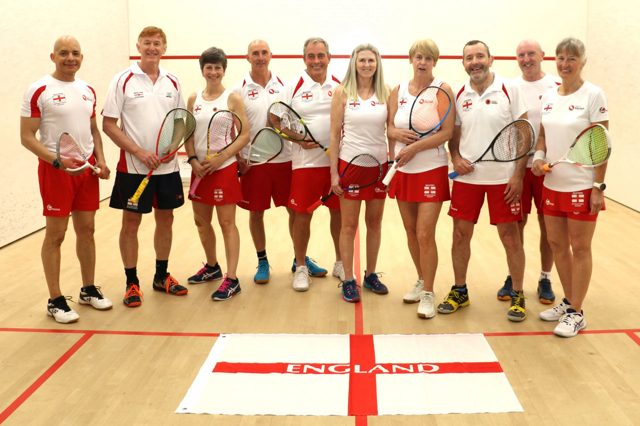 Teejay Sogunro with the England squash squad, wearing England kit on court