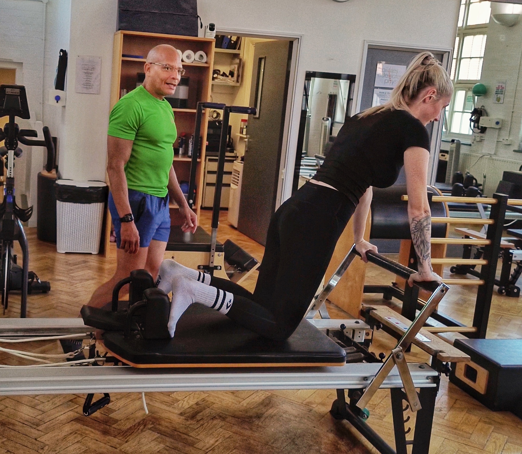Applied Pilates Studio Teejay Teching client Long Stretch Preps Applied Pilates Client on Reformer