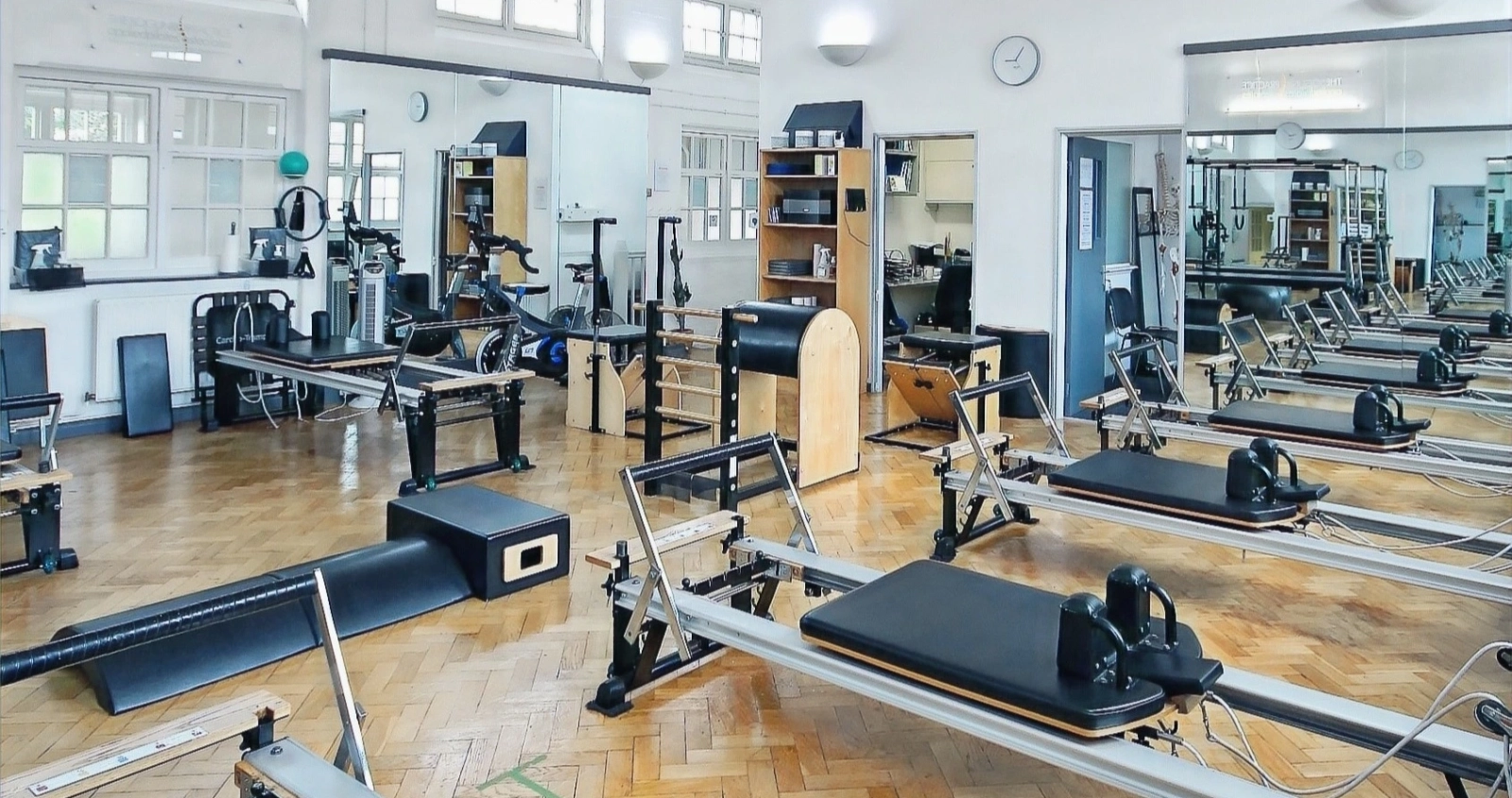 The full STOTT apparatus suite — Reformers, Cadillac, Ladder Barrel and Chair — at Applied Pilates, London Colney