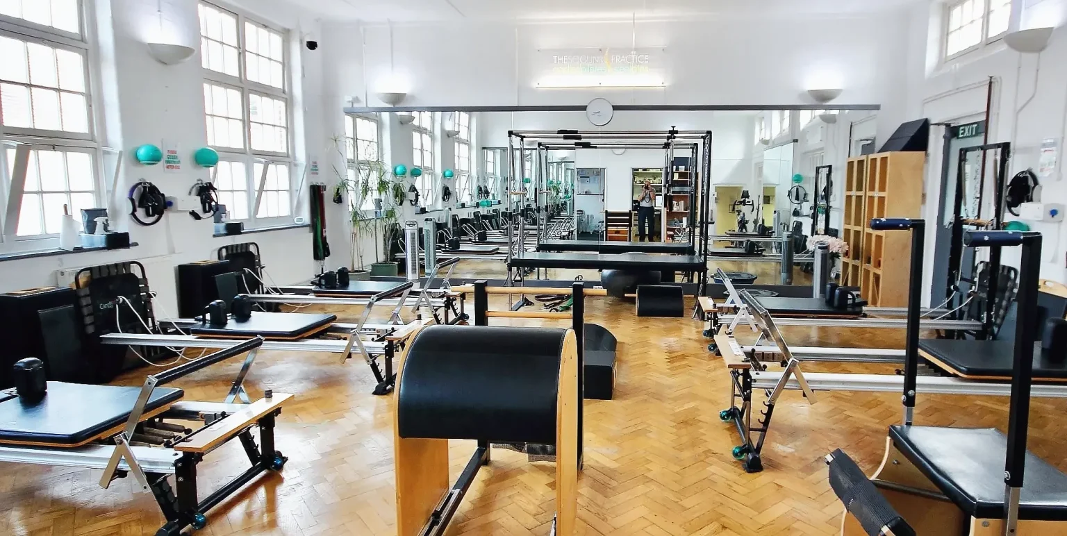 Reformers, Cadillac / Trapeze Table, Stability Chair, Ladder Barrel and Arc Barrel in the STOTT apparatus studio at Applied Pilates, London Colney, St Albans