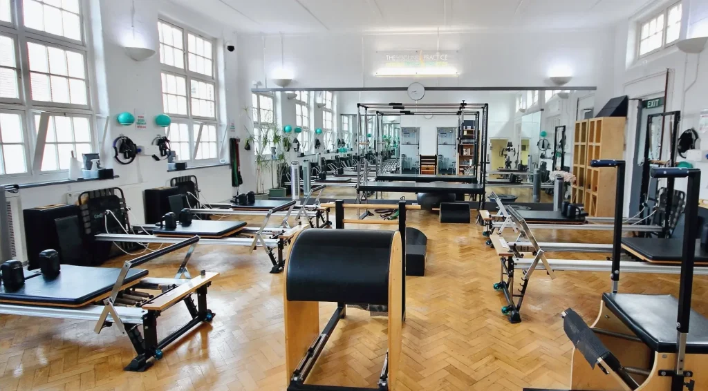 Reformers, Cadillac / Trapeze Table, Stability Chair, Ladder Barrel and Arc Barrel in the STOTT Pilates apparatus studio at Applied Pilates, London Colney, St Albans