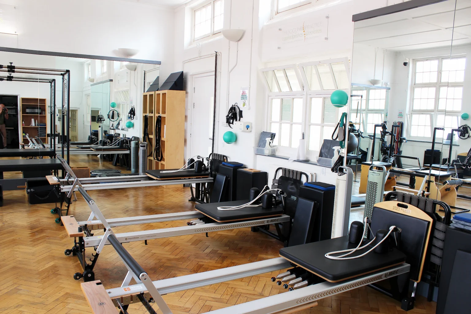 A row of STOTT Reformers in the studio at Applied Pilates, London Colney, St Albans